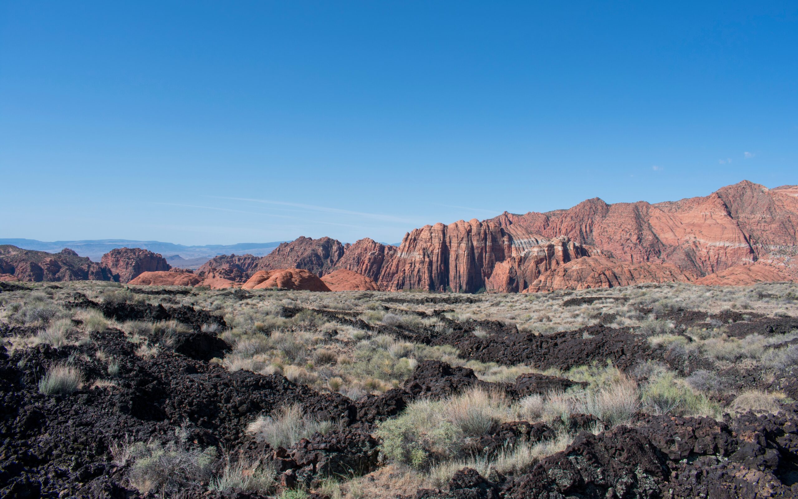 Breathtaking red rock formations and desert landscape in Ivins, Utah, showcasing the natural beauty surrounding custom home building opportunities.